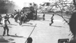 ph00004326n - Gun crews service Battery Hearn, Corregidor, 1939; notice artilleryman swinging from t