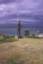 Ph00015346c - Statue of General MacArthur stands at the site of the north dock, Corregidor, where he